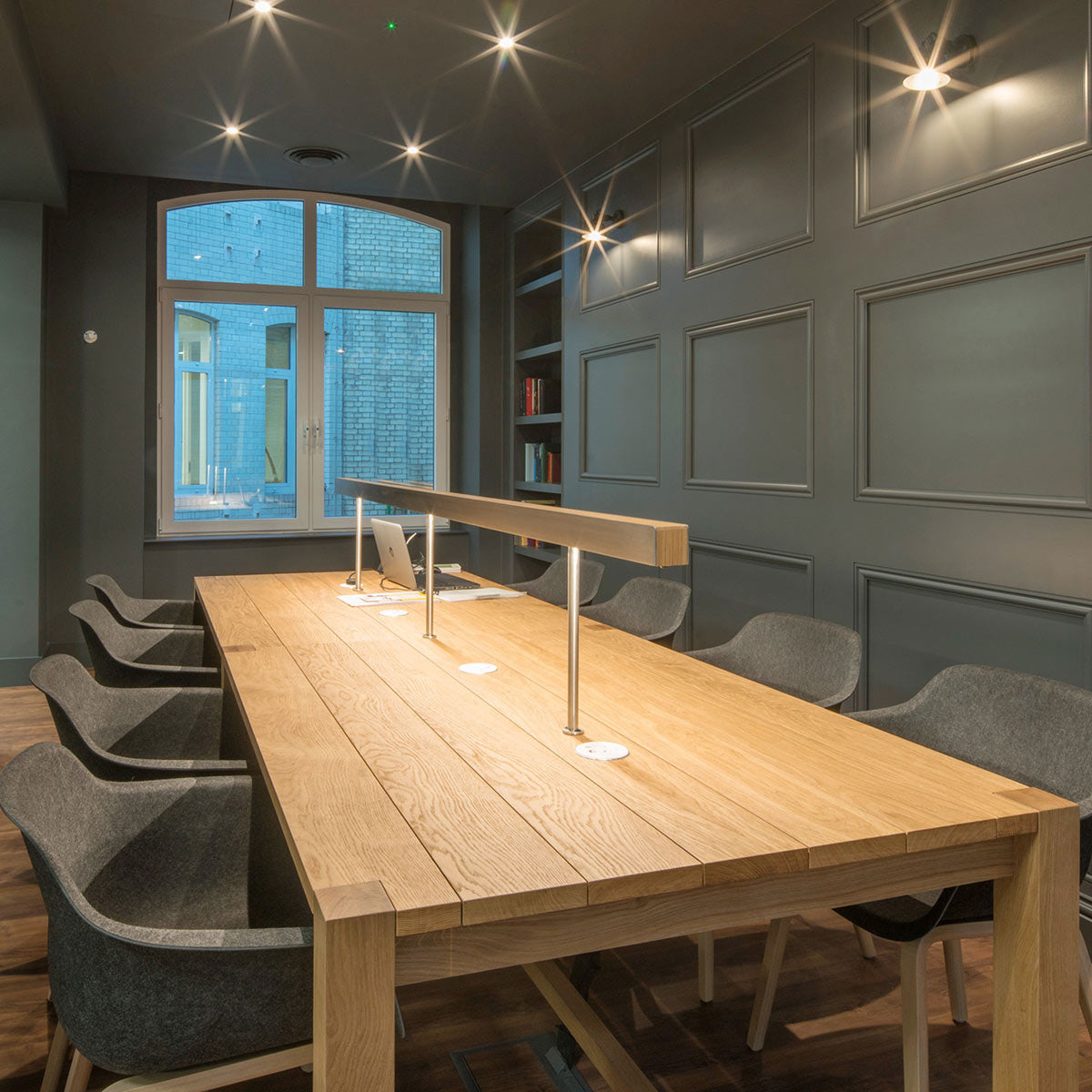 A Solid Oak Library Table with Desktop Mounted Linear Lighting and Power
