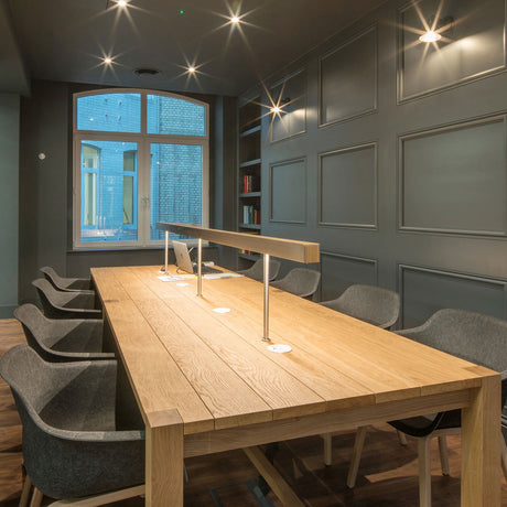 A Solid Oak Library Table with Desktop Mounted Linear Lighting and Power