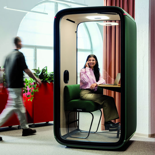 Framery One Lounge Pod With a Person Taking a Call