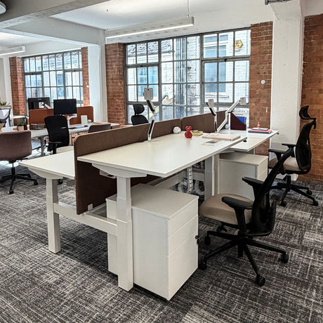Freeway Sit-Stand Double Bench Desk in an Office