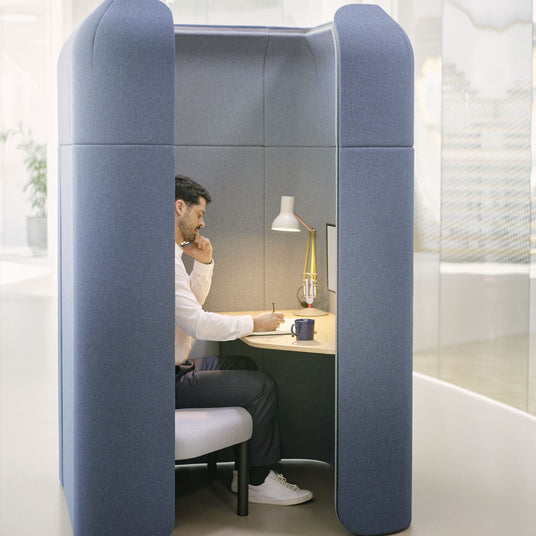 Sedus se:hive Private focus booth with upholstered bench and integrated desk in open plan office