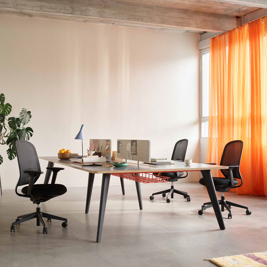 * Senator Elate task chairs in an open-plan office workspace